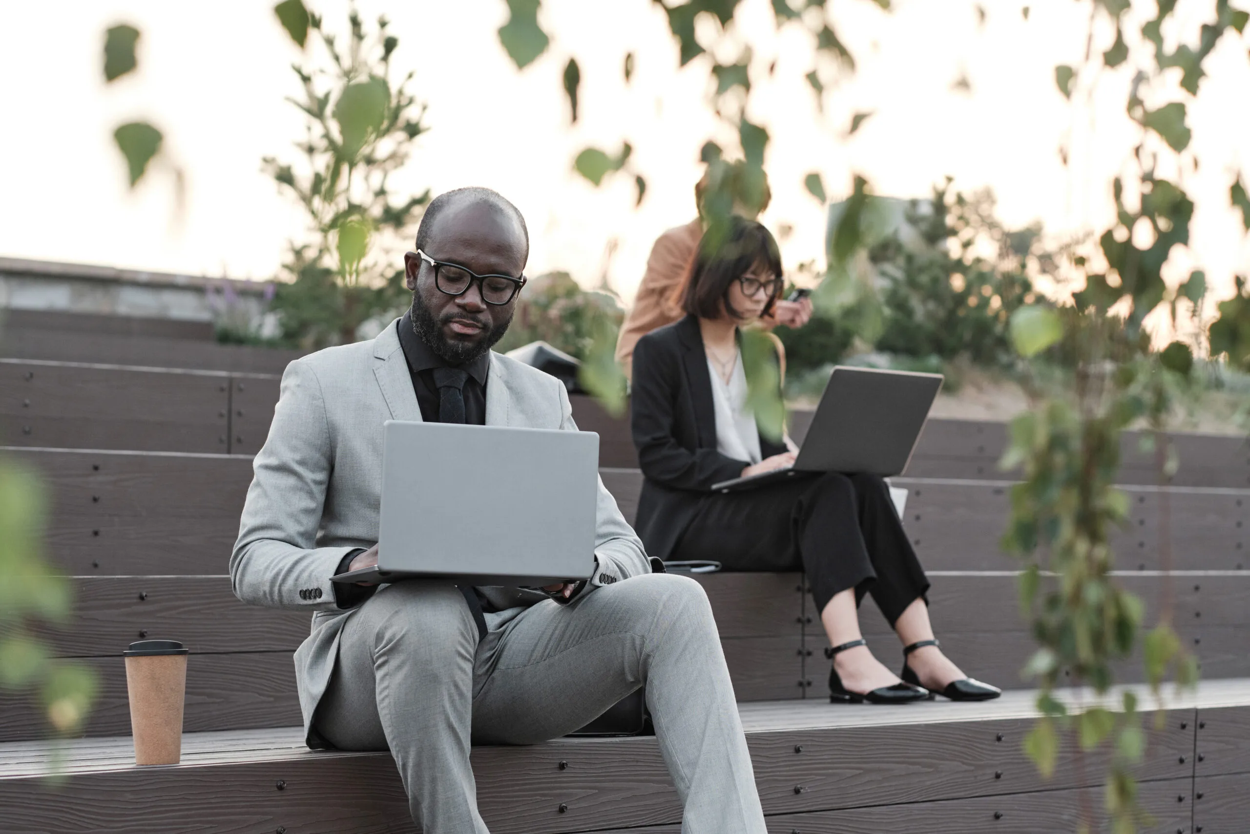 Business People Using Laptops Outdoors